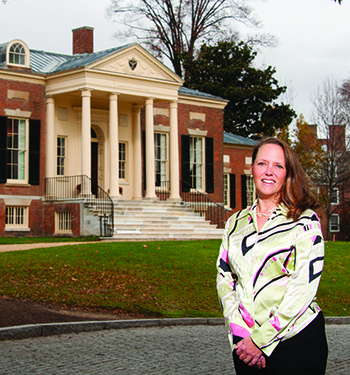 Catherine Rogers Arthur ’90 in front of the Homewood House Museum, where she serves as director and curator. The museum is located on the Johns Hopkins University campus in Baltimore.