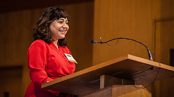 Photo of President Pareena Lawrence speaking at podium