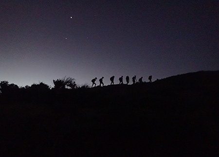 Photo of student hiking in pre-dawn in the Caribbean