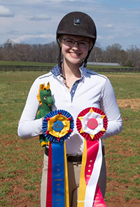 Caitlin Sheffer with riding medals