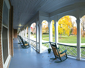 Rocking chairs on porch of Main