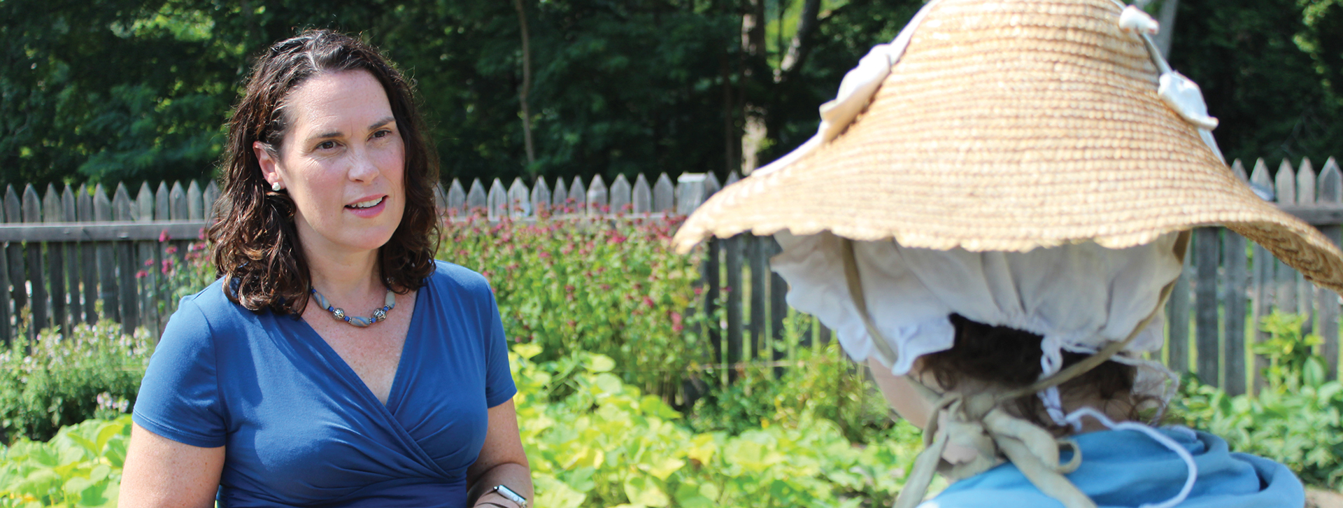 Julie Basic '96 speaks with an interpreter at the American Revolution Museum