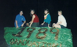 Students sitting on the Rock after painting it.