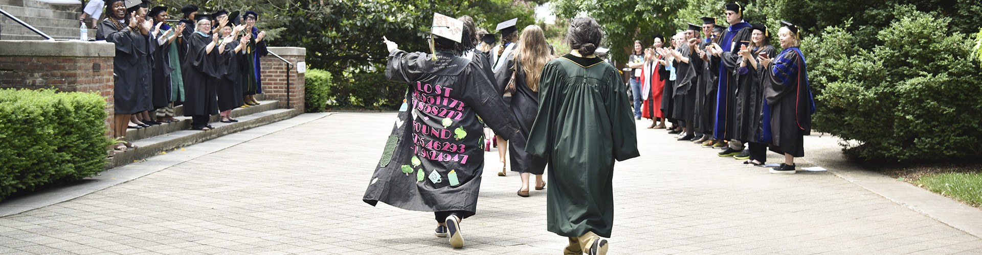 Faculty and staff congratulating 2022 graduates