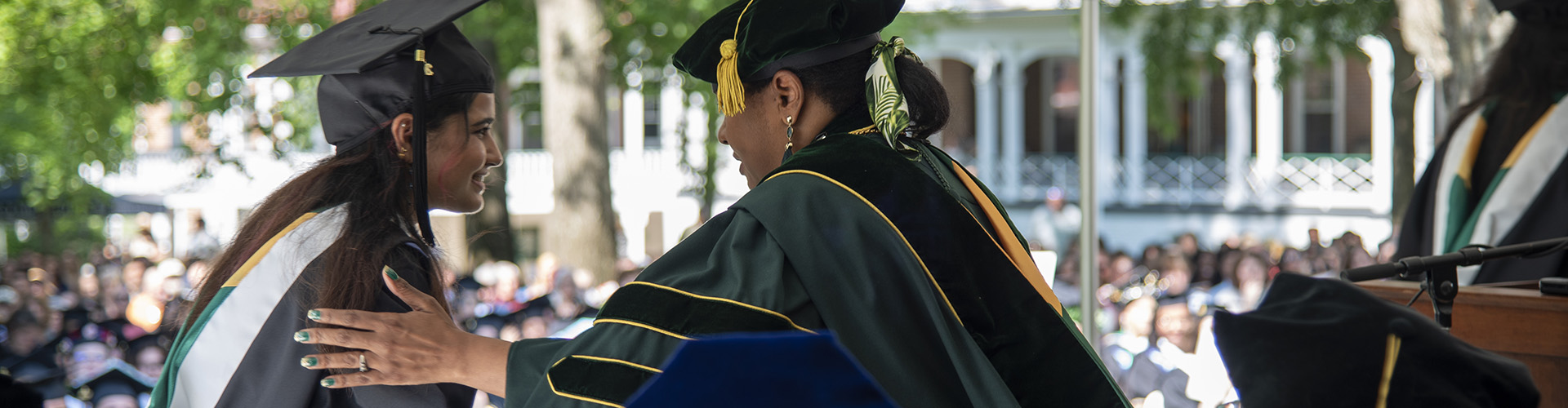 President Hinton congratulating graduate