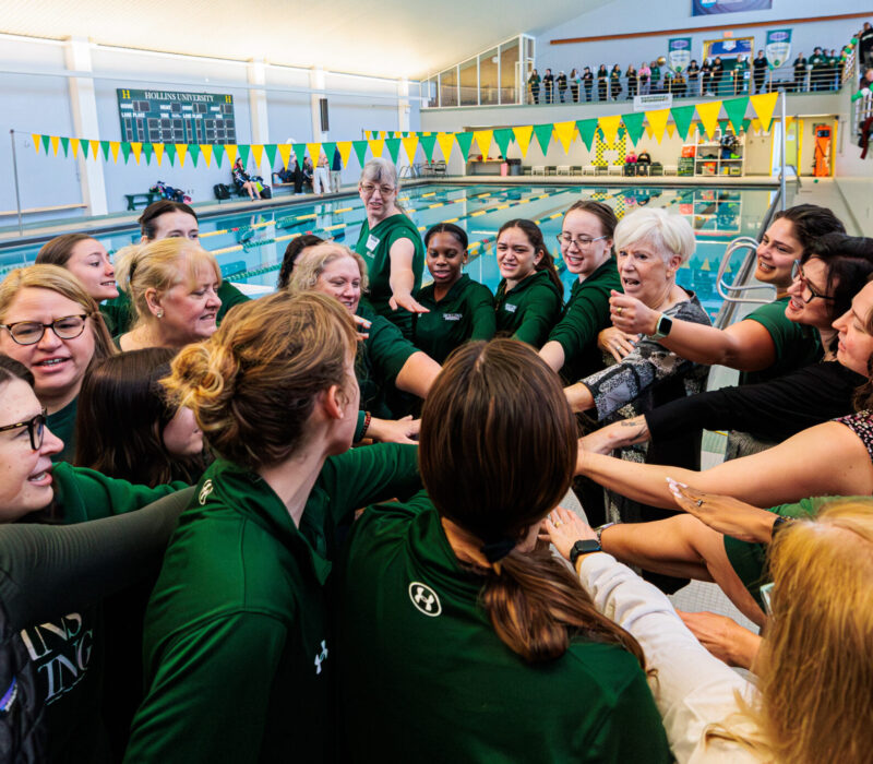 Calkins joins in cheering for Hollins athletes.