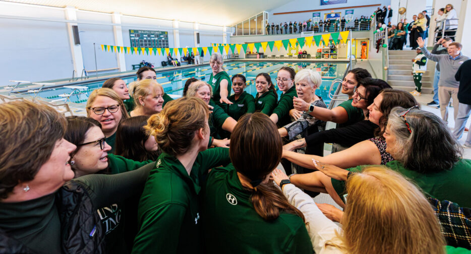 Calkins joins in cheering for Hollins athletes.