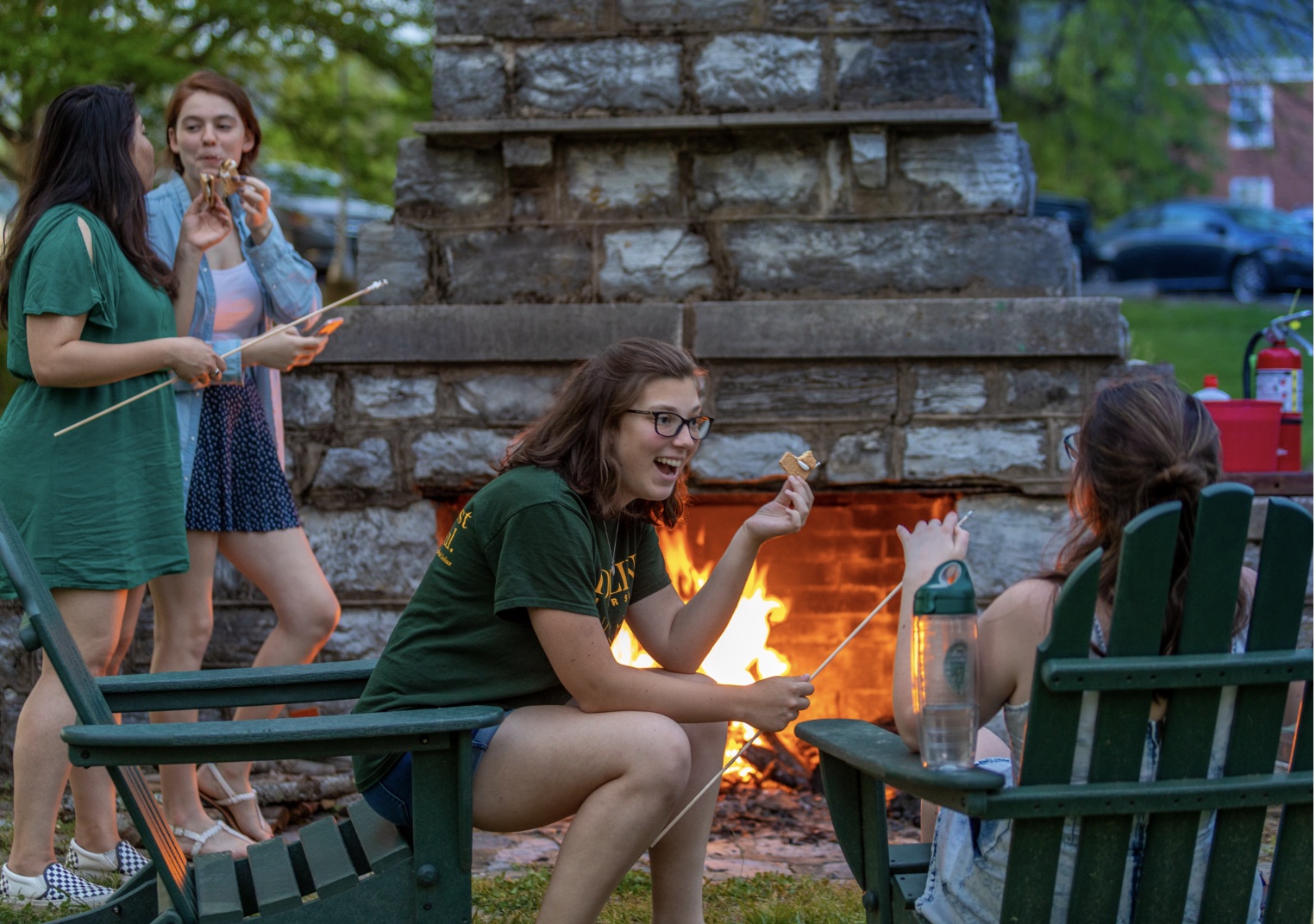 Students socializing by fireplace
