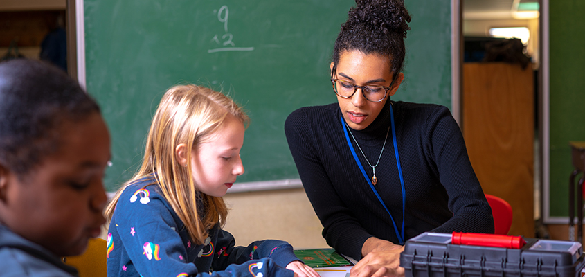 Teacher teaching students