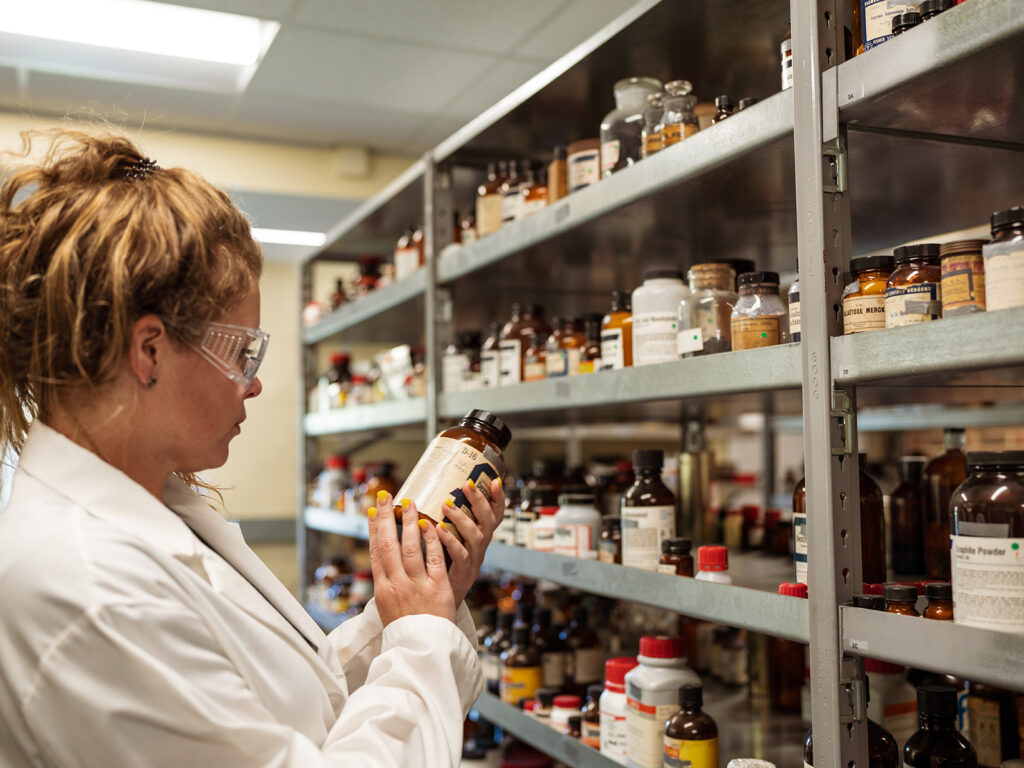 Student in Hollins chemicals storeroom